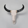 Decorative bull skull with large black horns wall hanging
