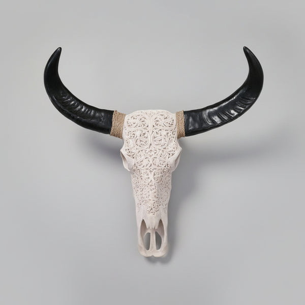 Decorative bull skull with large black horns wall hanging
